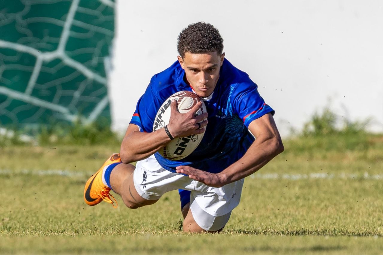 Debutant Jaylon Carew celebrates after scoring a hat-trick in the Welwitschias Invitational XVu0027s 71-12 victory over Zambia. PHOTO NAMPICS/FLORIS VAN SCHOUWENBURG